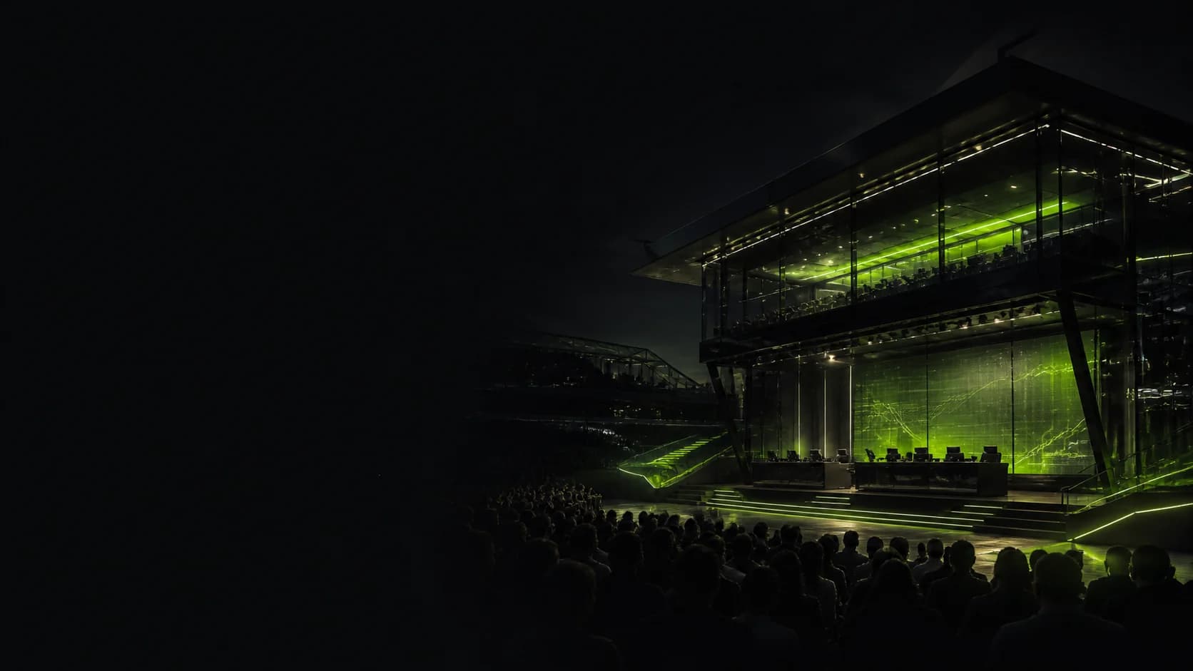 A nighttime Alpha League competition pavilion surrounded by spectators